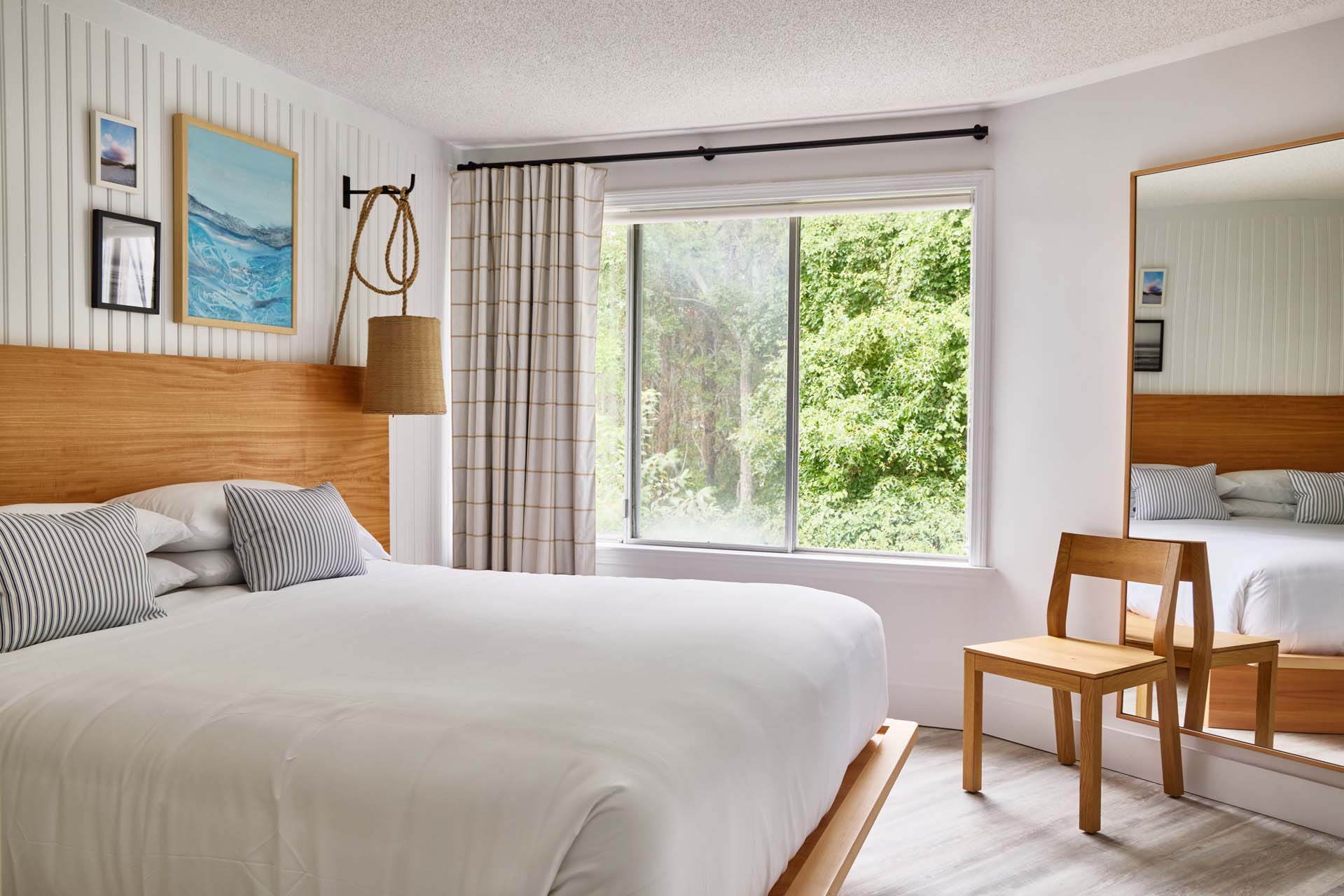 One King guest room with a king bed beside a window